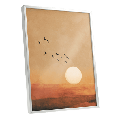 Flight at Amber Dusk, beige, orange, brown nature wall art shown as a silver framed poster wall art print