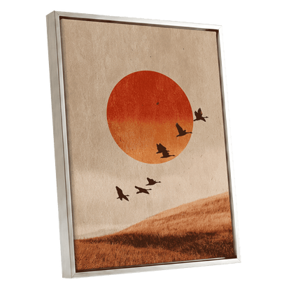 Flock at Burnished Sunset, beige, orange, red nature wall art shown as a silver framed canvas wall art