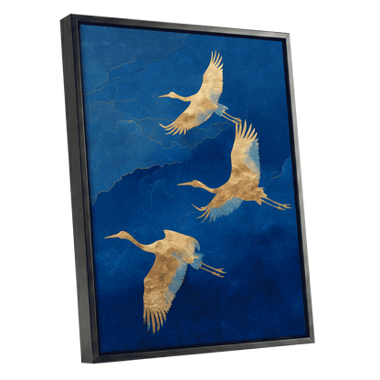 Gilded Crane Flight, blue, gold, beige nature wall art shown as a black framed canvas wall art