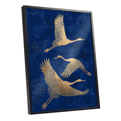 Gilded Cranes in Flight, blue, gold, beige nature wall art shown as a black framed poster wall art print