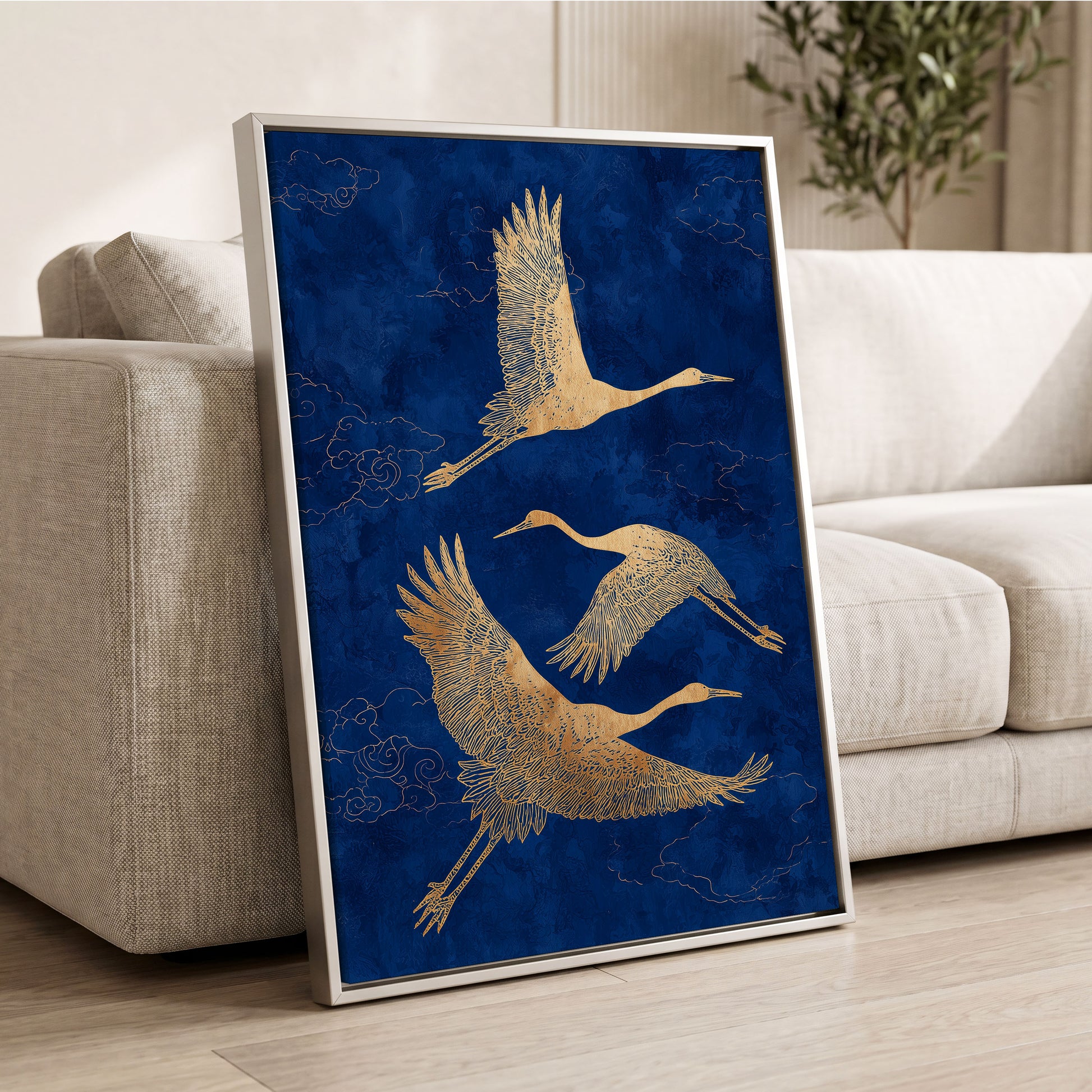Gilded Cranes in Flight, blue, gold, beige nature wall art displayed in a styled interior, gallery view 2