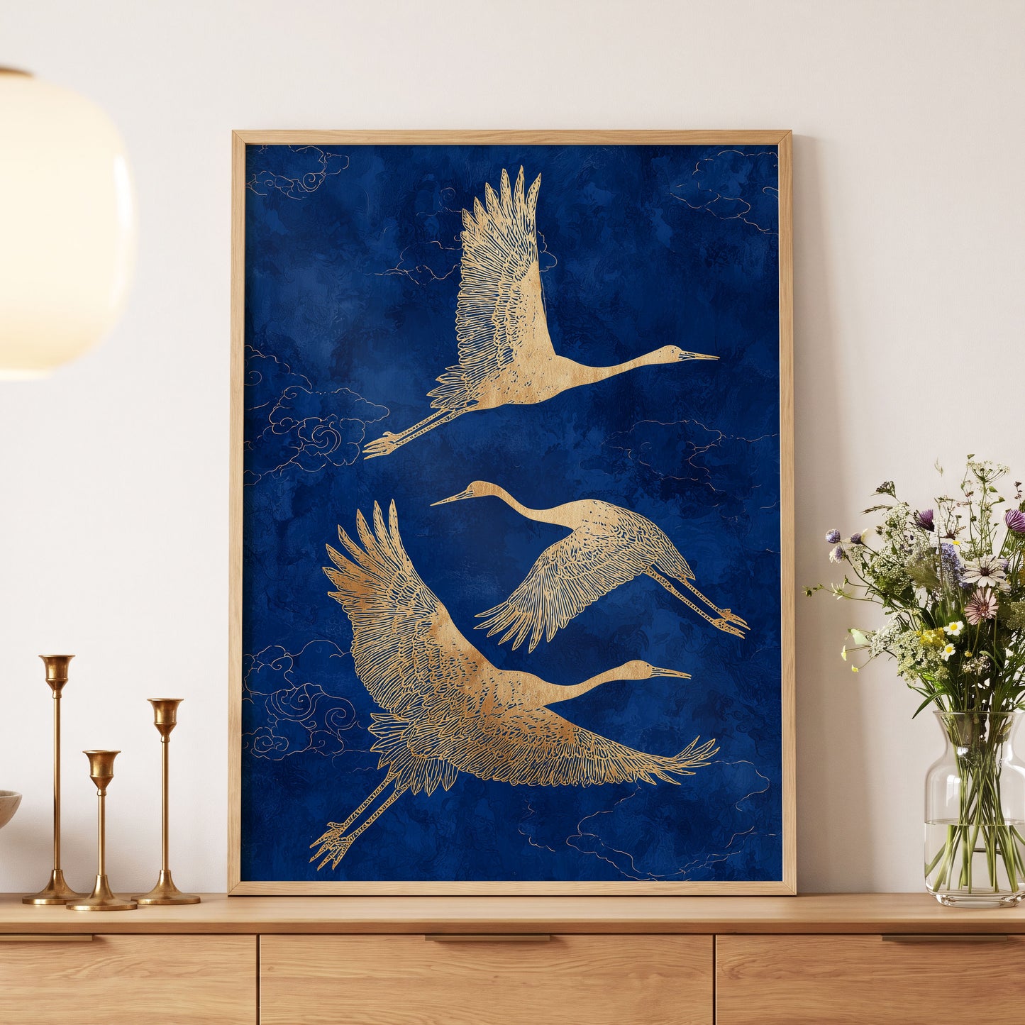 Gilded Cranes in Flight, blue, gold, beige nature wall art displayed in a styled interior, gallery view 5