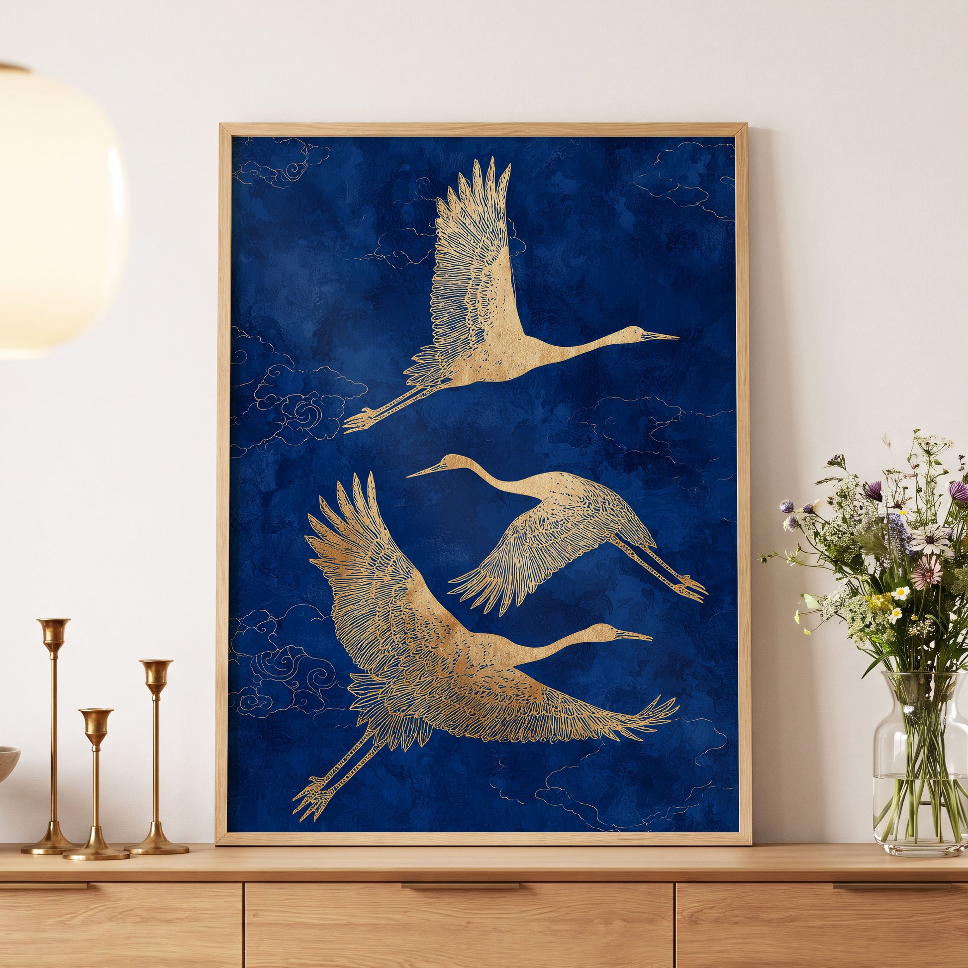 Gilded Cranes in Flight, blue, gold, beige nature wall art displayed in a styled interior, gallery view 5