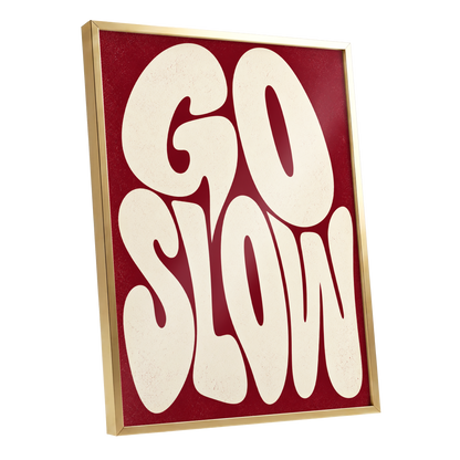 Go Slow Ruby, red, beige abstract wall art shown as a gold framed poster wall art print
