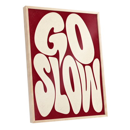 Go Slow Ruby, red, beige abstract wall art shown as a oak framed poster wall art print