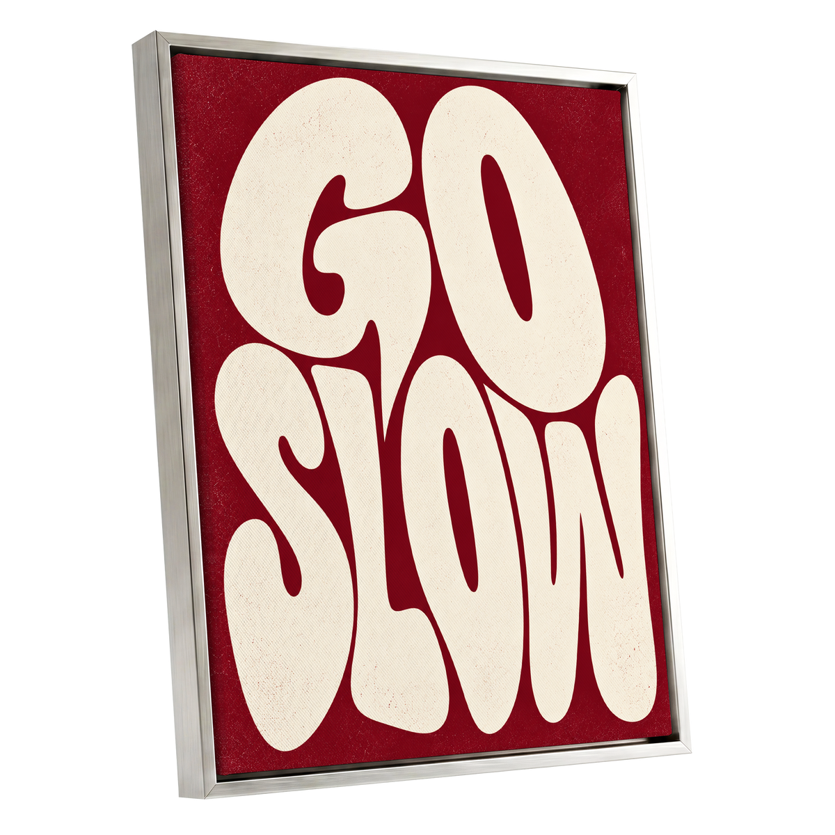 Go Slow Ruby, red, beige abstract wall art shown as a silver framed canvas wall art
