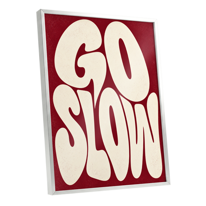 Go Slow Ruby, red, beige abstract wall art shown as a silver framed poster wall art print