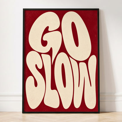 Go Slow Ruby, red, beige abstract wall art displayed in a styled interior, gallery view 3