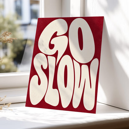 Go Slow Ruby, red, beige abstract wall art displayed in a styled interior, gallery view 4