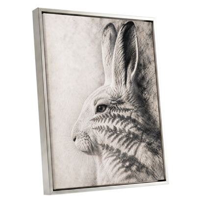 Hare in Hushed Light, white, gray, black nature wall art shown as a silver framed canvas wall art