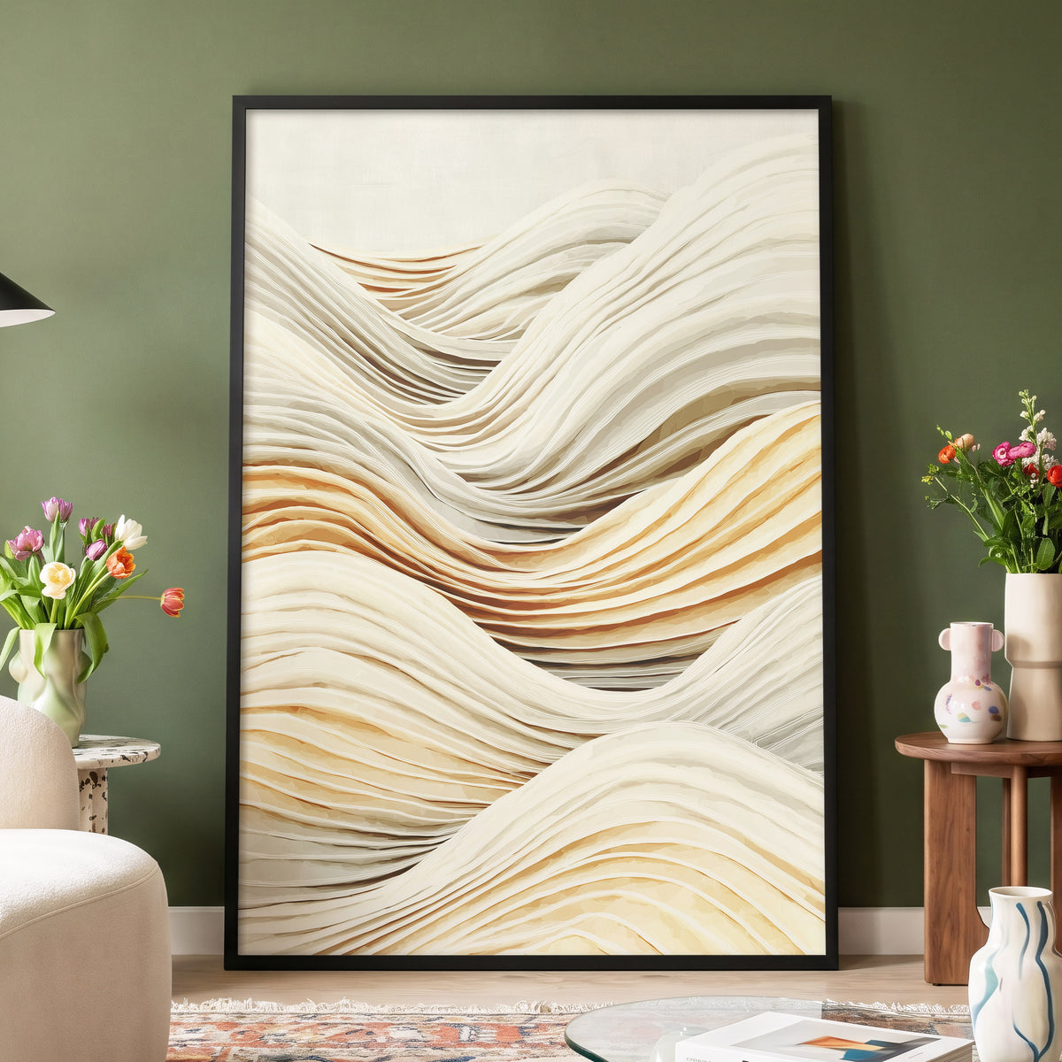 Ivory Layered Waves: a large framed abstract wall art print with flowing layered wave-like lines in cream, beige, and light brown tones, displayed against an olive green wall in a styled living room setting.