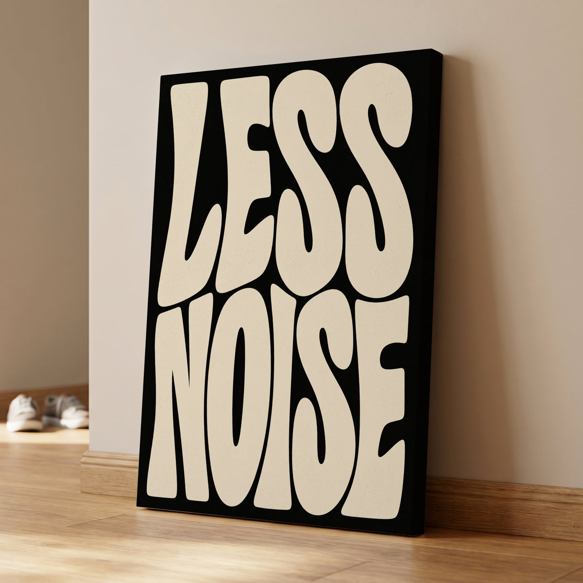 Less Noise, black, beige minimalist wall art on canvas displayed in a styled interior, gallery view 1
