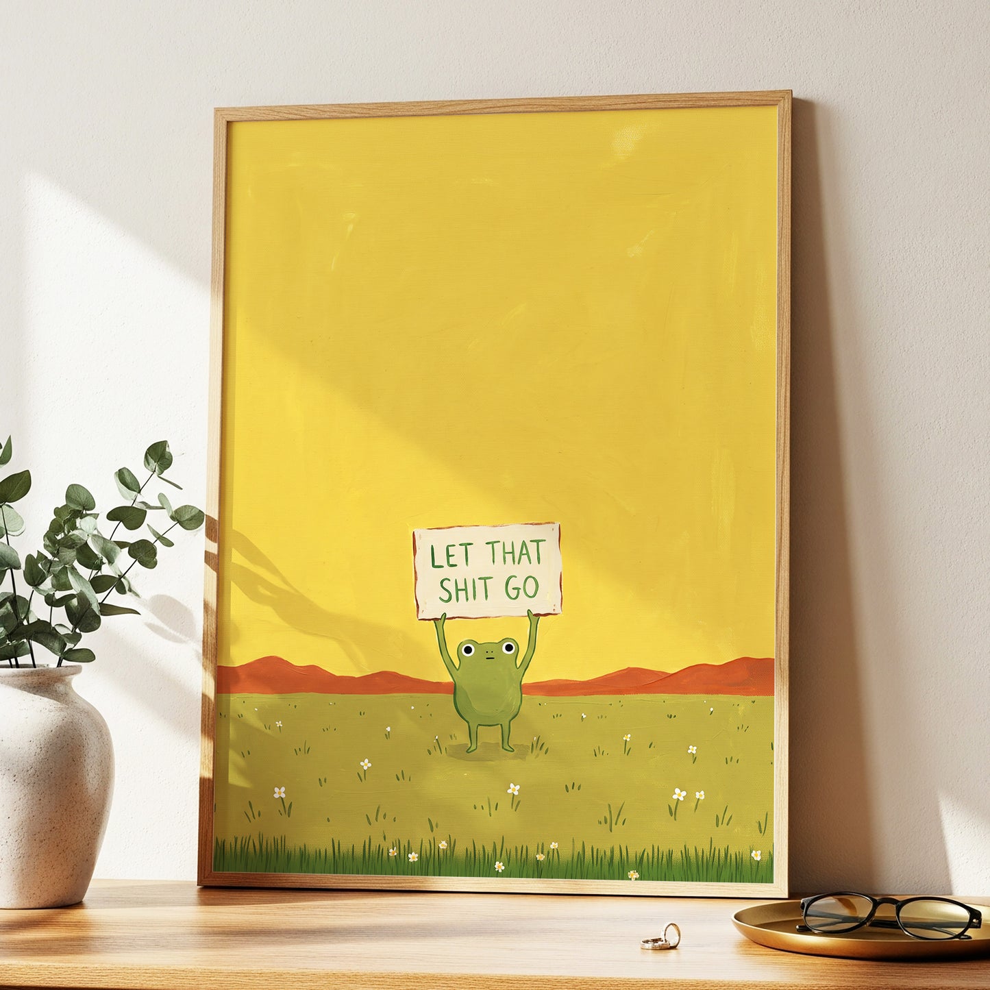 Let It Go, Little Frog, yellow, green, brown nature wall art displayed in a styled interior, gallery view 9