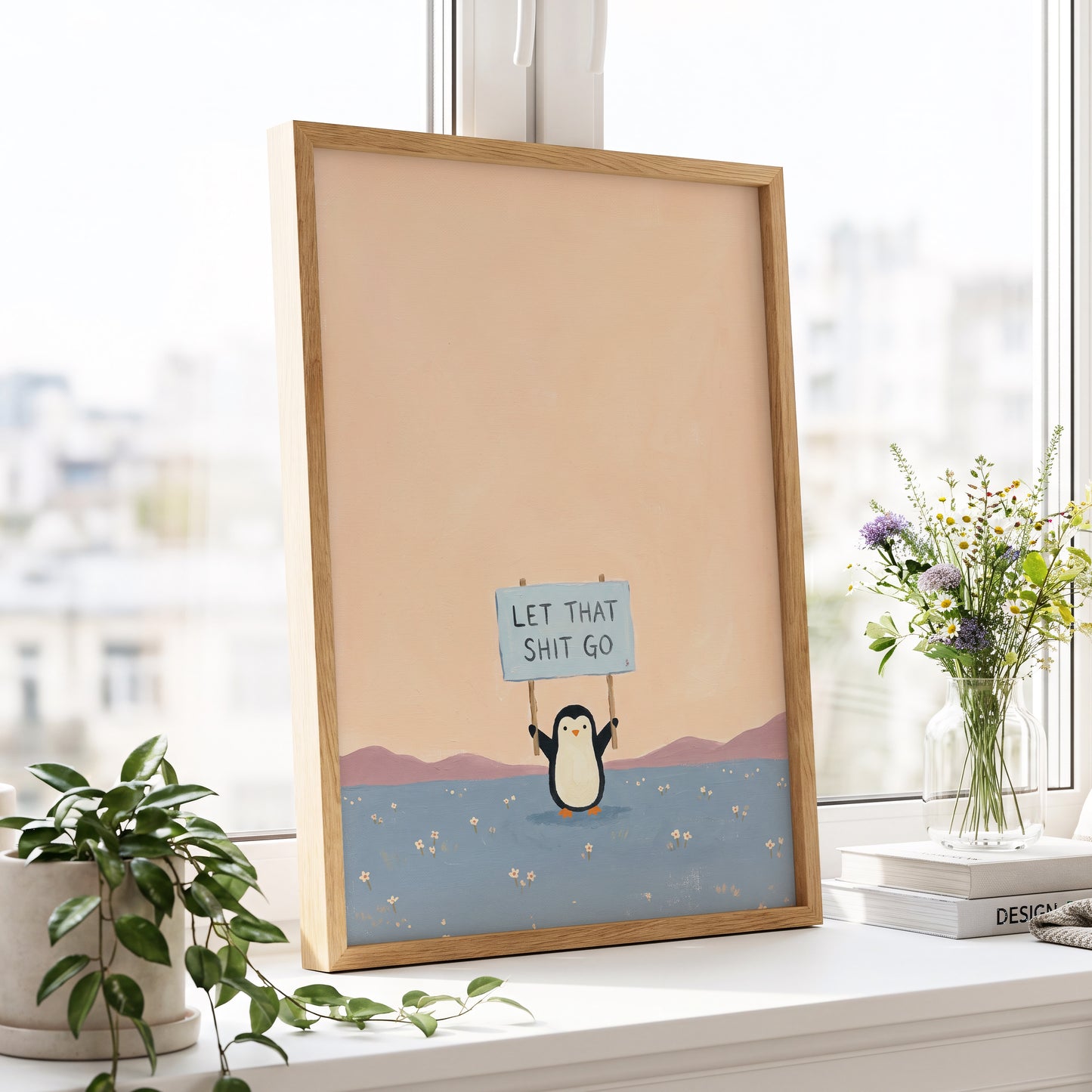 Let It Go Penguin, pink, blue, purple nature wall art displayed in a styled interior, gallery view 2