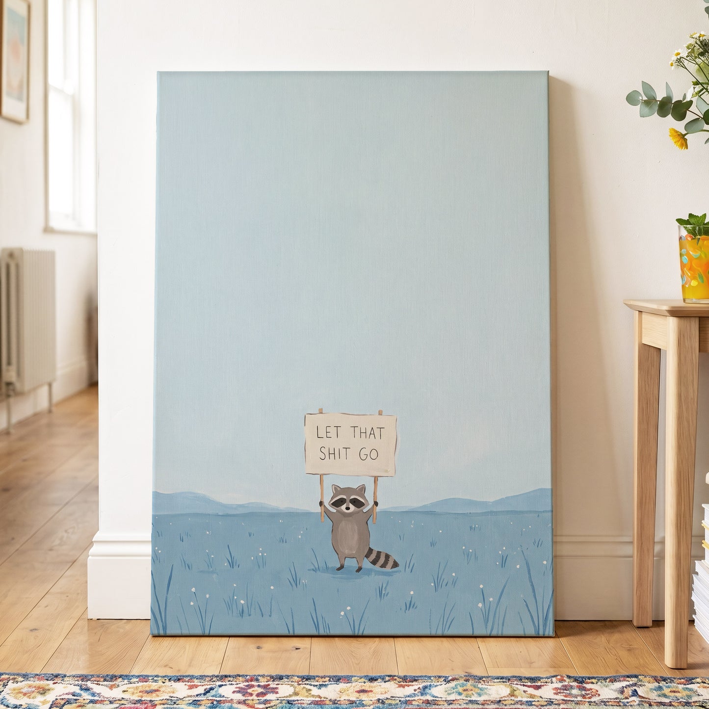 Let It Go Raccoon, blue, beige, gray nature wall art displayed in a styled interior, gallery view 3