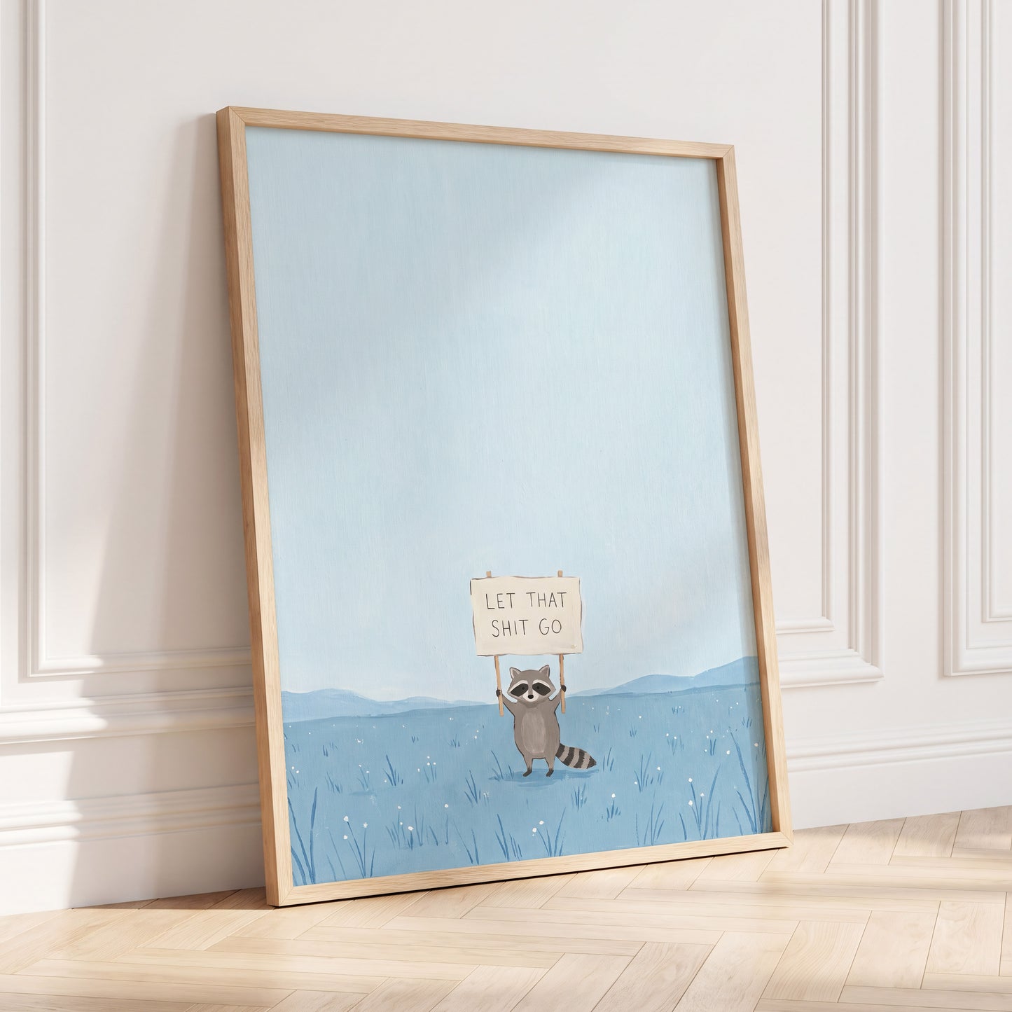 Let It Go Raccoon, blue, beige, gray nature wall art displayed in a styled interior, gallery view 6