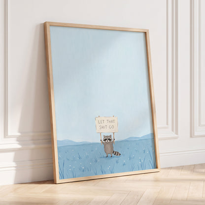 Let It Go Raccoon, blue, beige, gray nature wall art displayed in a styled interior, gallery view 6
