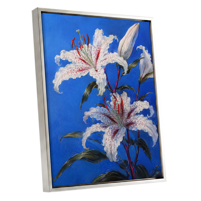 Lilies in Cobalt, blue, white, green floral wall art shown as a silver framed canvas wall art