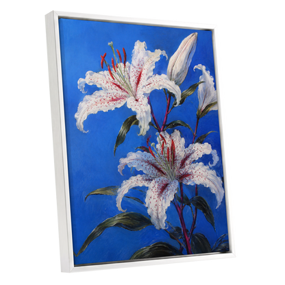 Lilies in Cobalt, blue, white, green floral wall art shown as a white framed canvas wall art