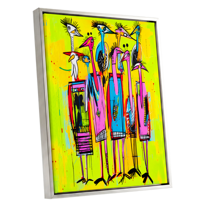 Neon Wading Birds, yellow, pink, blue nature wall art shown as a silver framed canvas wall art