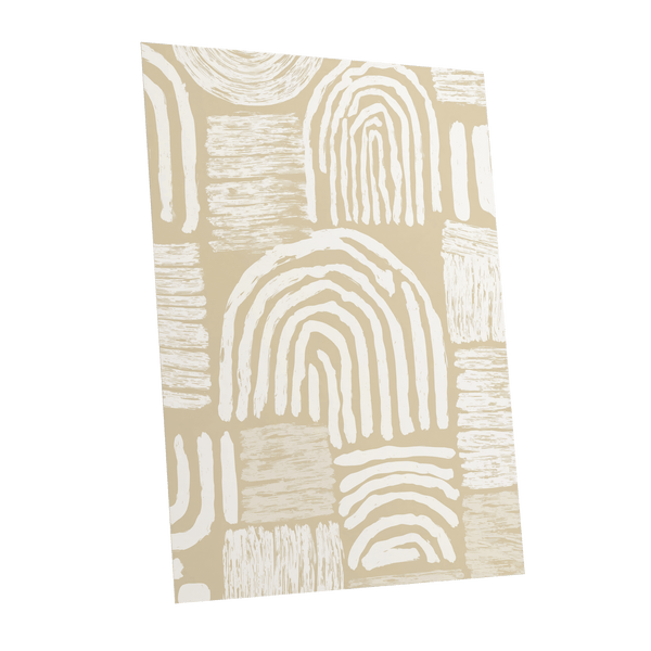 Neutral Boho Arches: a vertical art print or wallpaper panel featuring a modern abstract pattern of hand-drawn arches and textured blocks in cream and beige on a warm tan background, shown at a slight angle against a white backdrop.