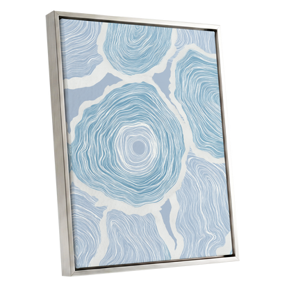 Pale Tidal Whorls, blue, white, gray abstract wall art shown as a silver framed canvas wall art