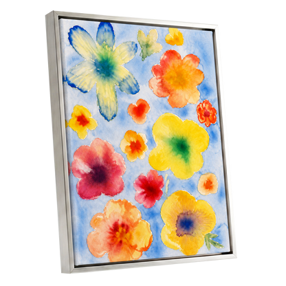 Petal Confetti, blue, yellow, orange floral wall art shown as a silver framed canvas wall art