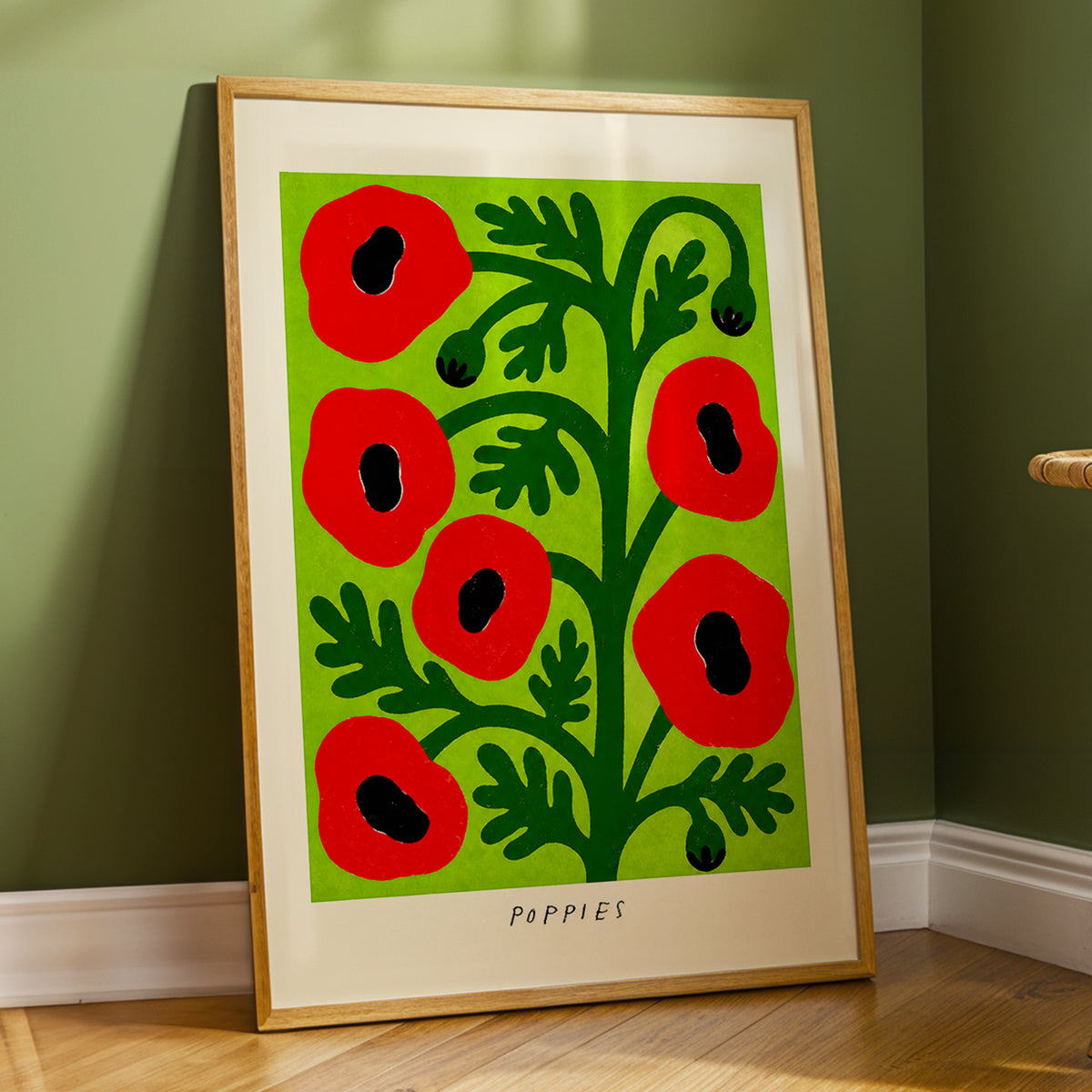 Poppies on Lime, red, green, black floral wall art displayed in a styled interior, gallery view 2