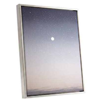 Quiet Orbit, gray, white, gold nature wall art shown as a silver framed canvas wall art