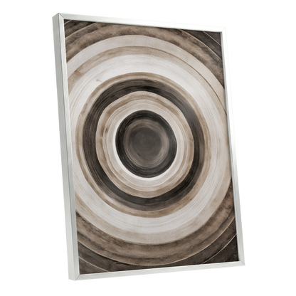 Quiet Orbit, black, brown, beige abstract wall art shown as a silver framed poster wall art print
