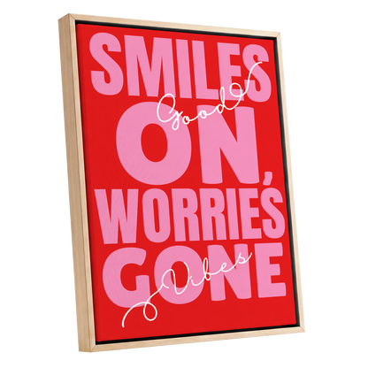 Smiles On, Worries Gone, red, pink, white minimalist wall art shown as a oak framed canvas wall art