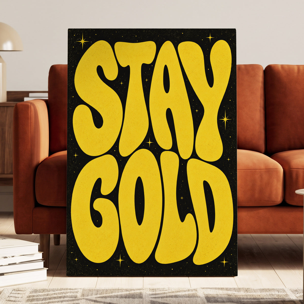 Stay Gold Starburst, yellow, black abstract wall art on canvas displayed in a styled interior, gallery view 1