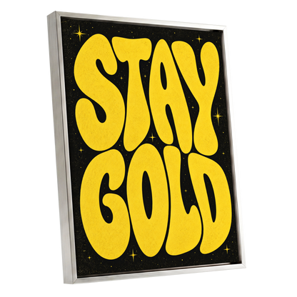 Stay Gold Starburst, yellow, black abstract wall art shown as a silver framed canvas wall art