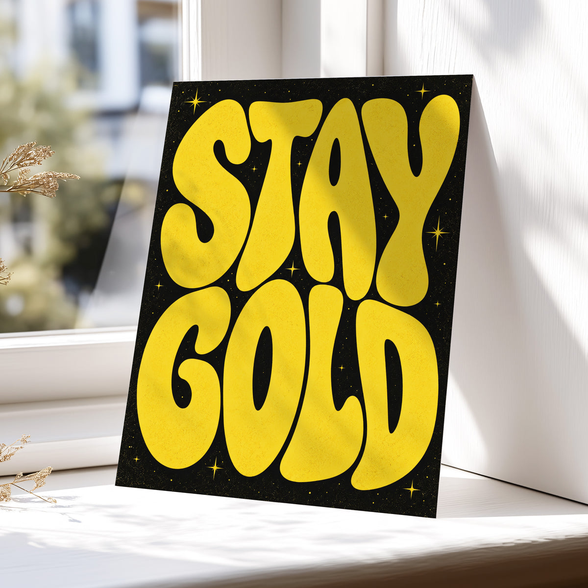 Stay Gold Starburst, yellow, black abstract wall art displayed in a styled interior, gallery view 5