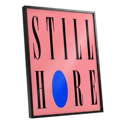 Still Here in Blue, black, pink, blue minimalist wall art shown as a black framed poster wall art print