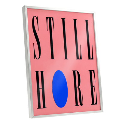 Still Here in Blue, black, pink, blue minimalist wall art shown as a silver framed poster wall art print