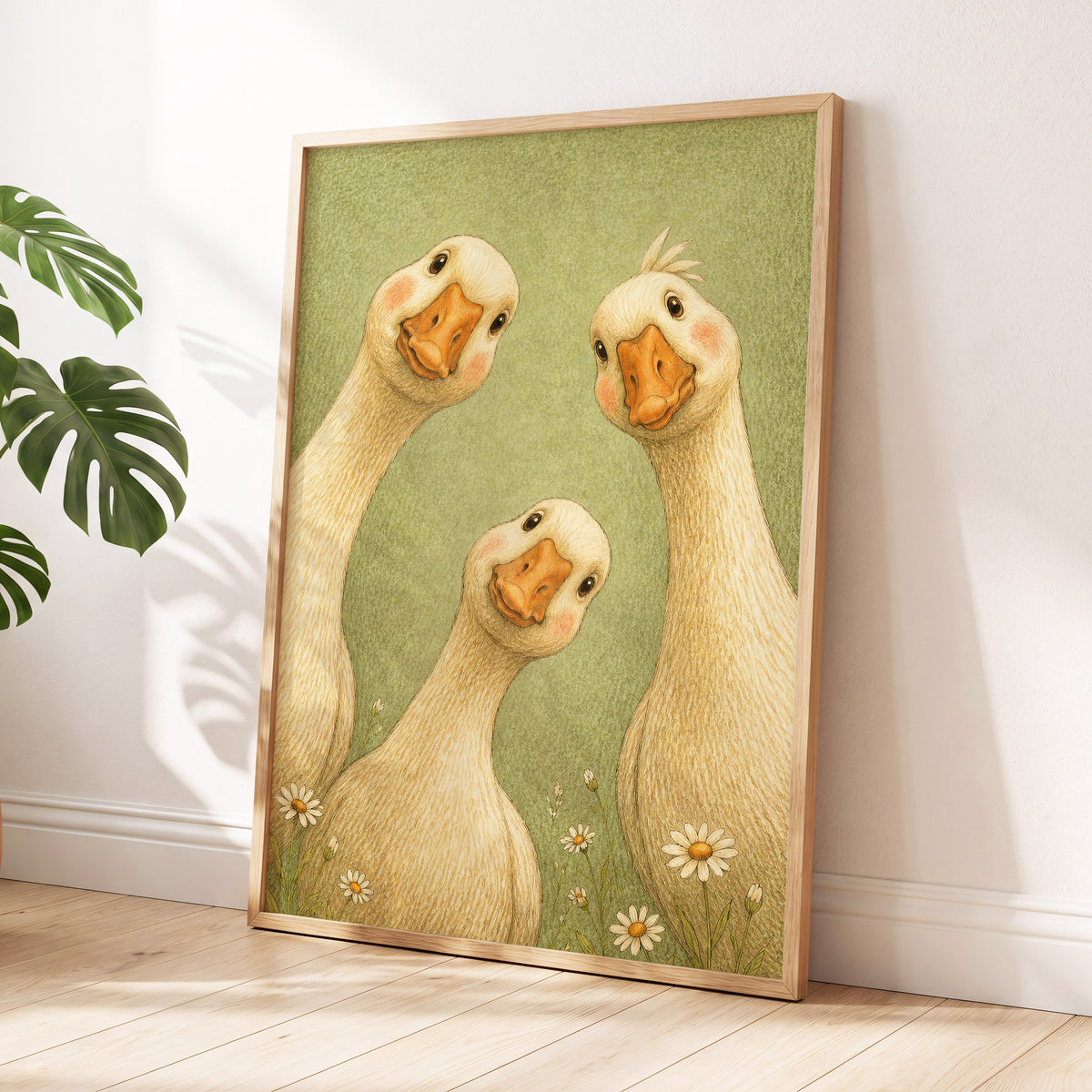 The Curious Goose Trio, green, beige, white nature wall art displayed in a styled interior, gallery view 2