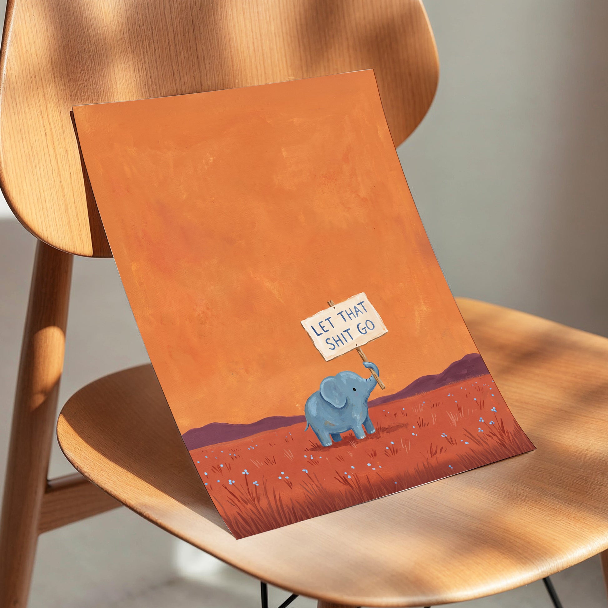 The Let-Go Elephant, orange, red, blue nature wall art displayed in a styled interior, gallery view 5