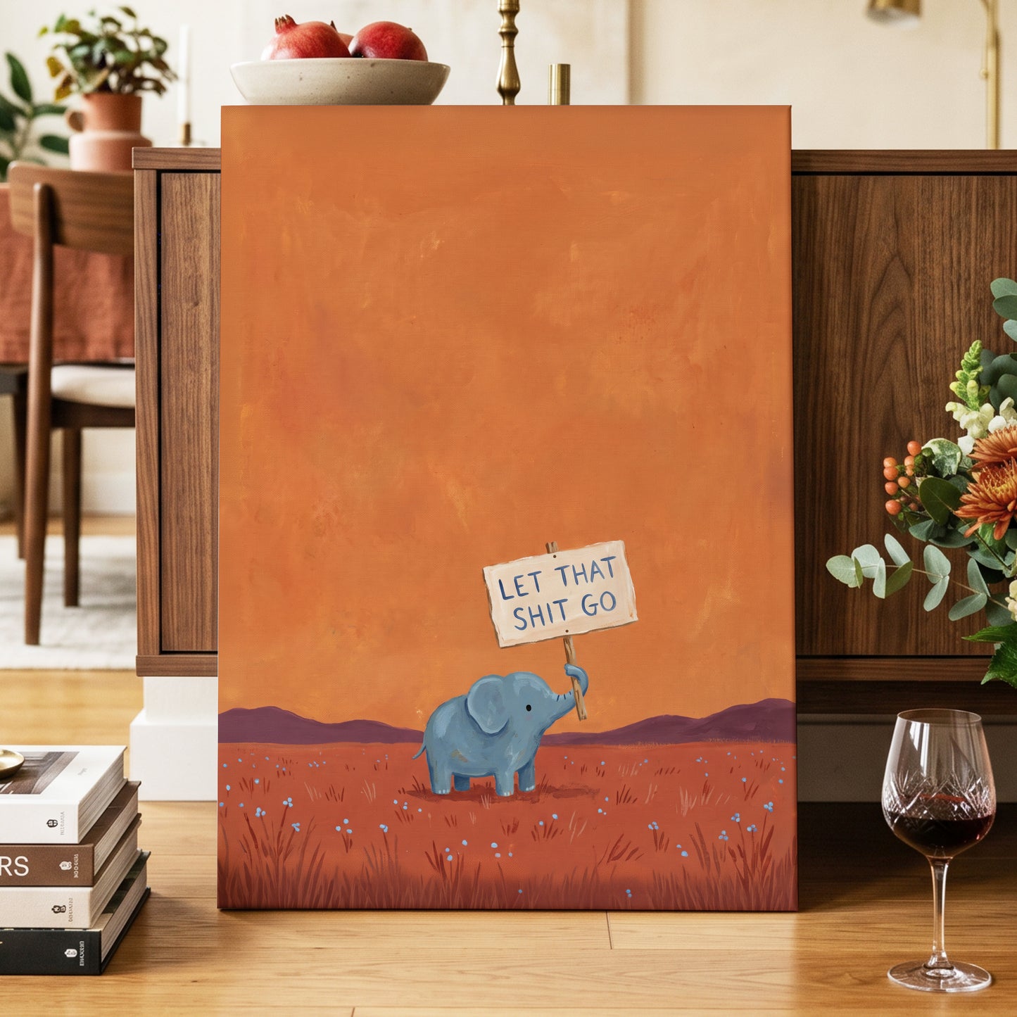 The Let-Go Elephant, orange, red, blue nature wall art displayed in a styled interior, gallery view 7