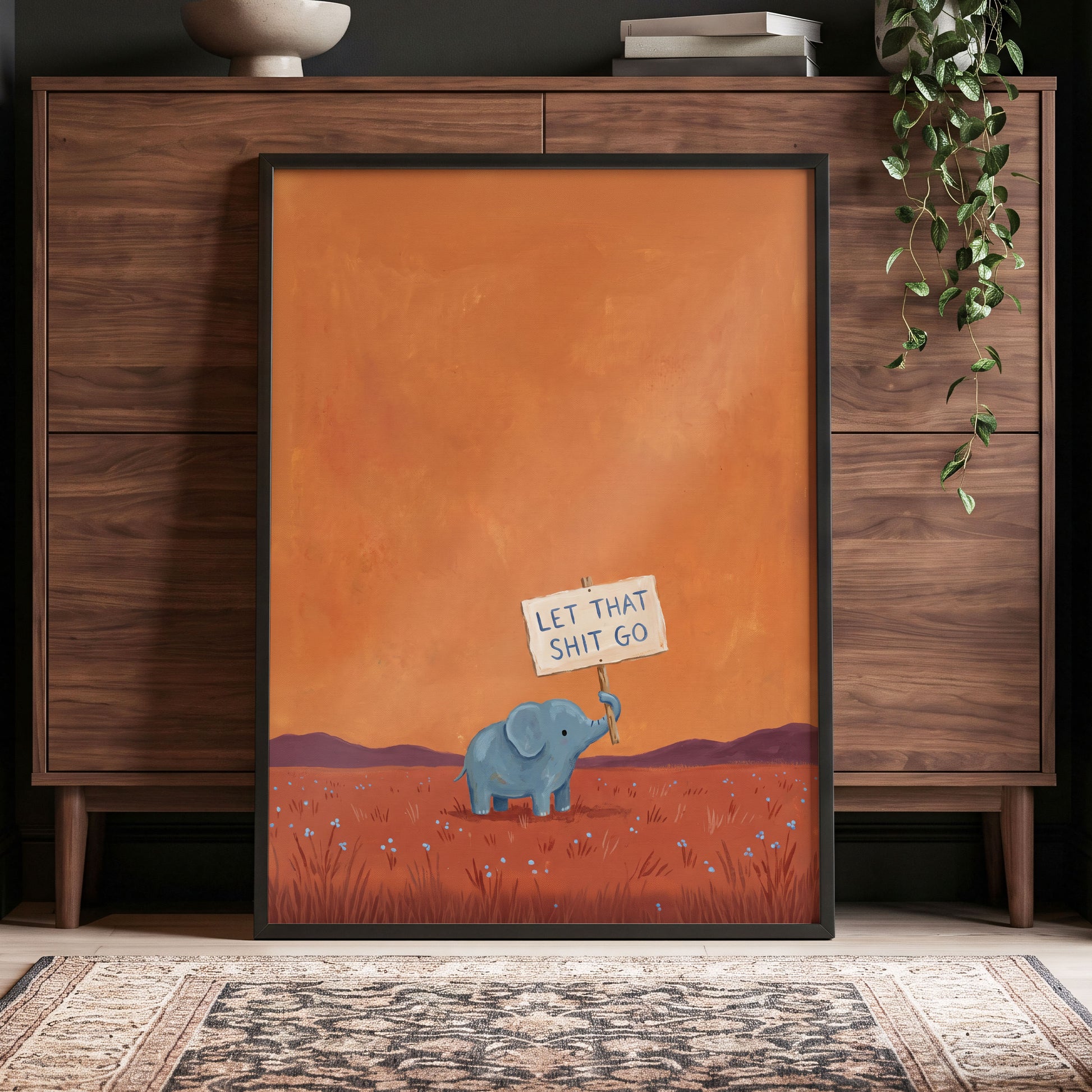 The Let-Go Elephant, orange, red, blue nature wall art displayed in a styled interior, gallery view 9