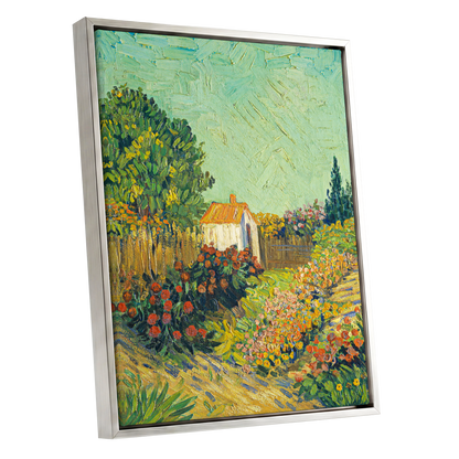 The Sunlit Cottage Garden, green, yellow, orange floral wall art shown as a silver framed canvas wall art