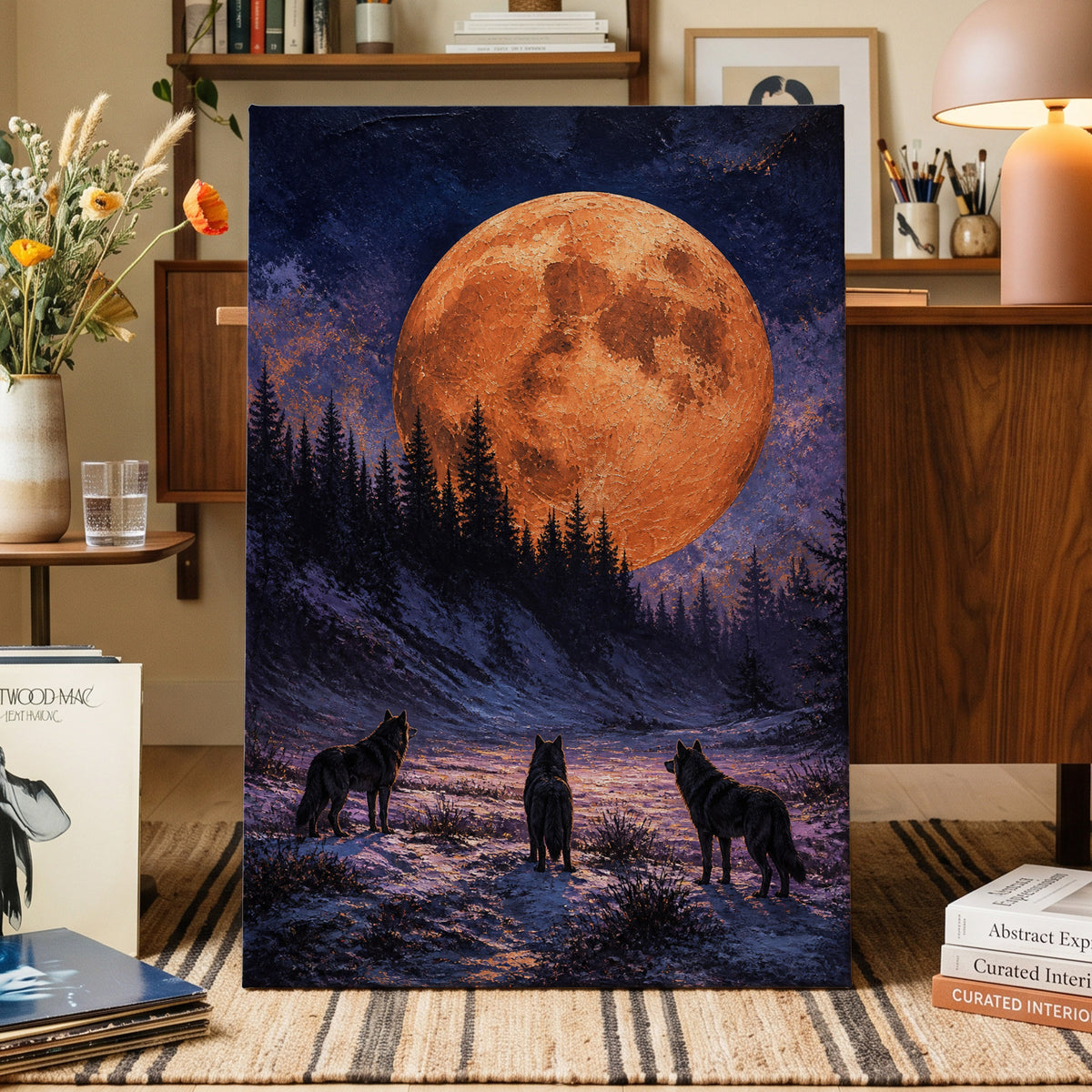 Wolves Beneath Ember Moon, orange, blue, black nature wall art on canvas displayed in a styled interior, gallery view 1